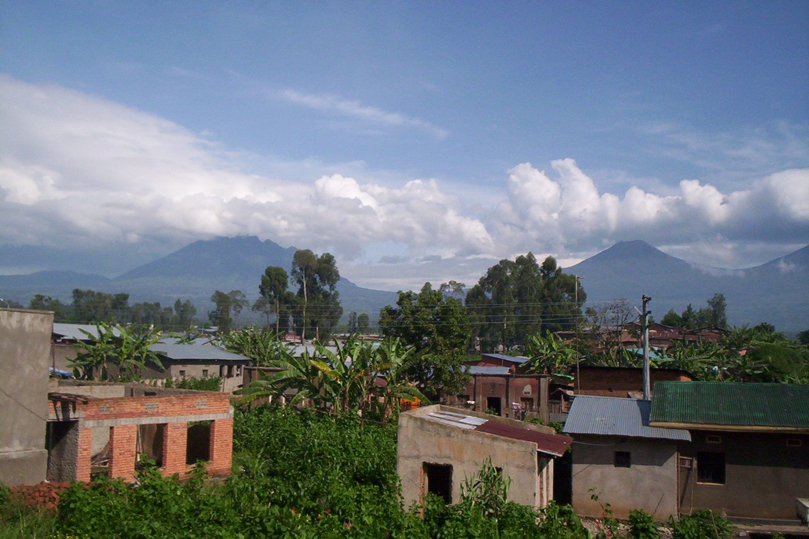 The Virunga volcanoes rising above farmland near Musanze